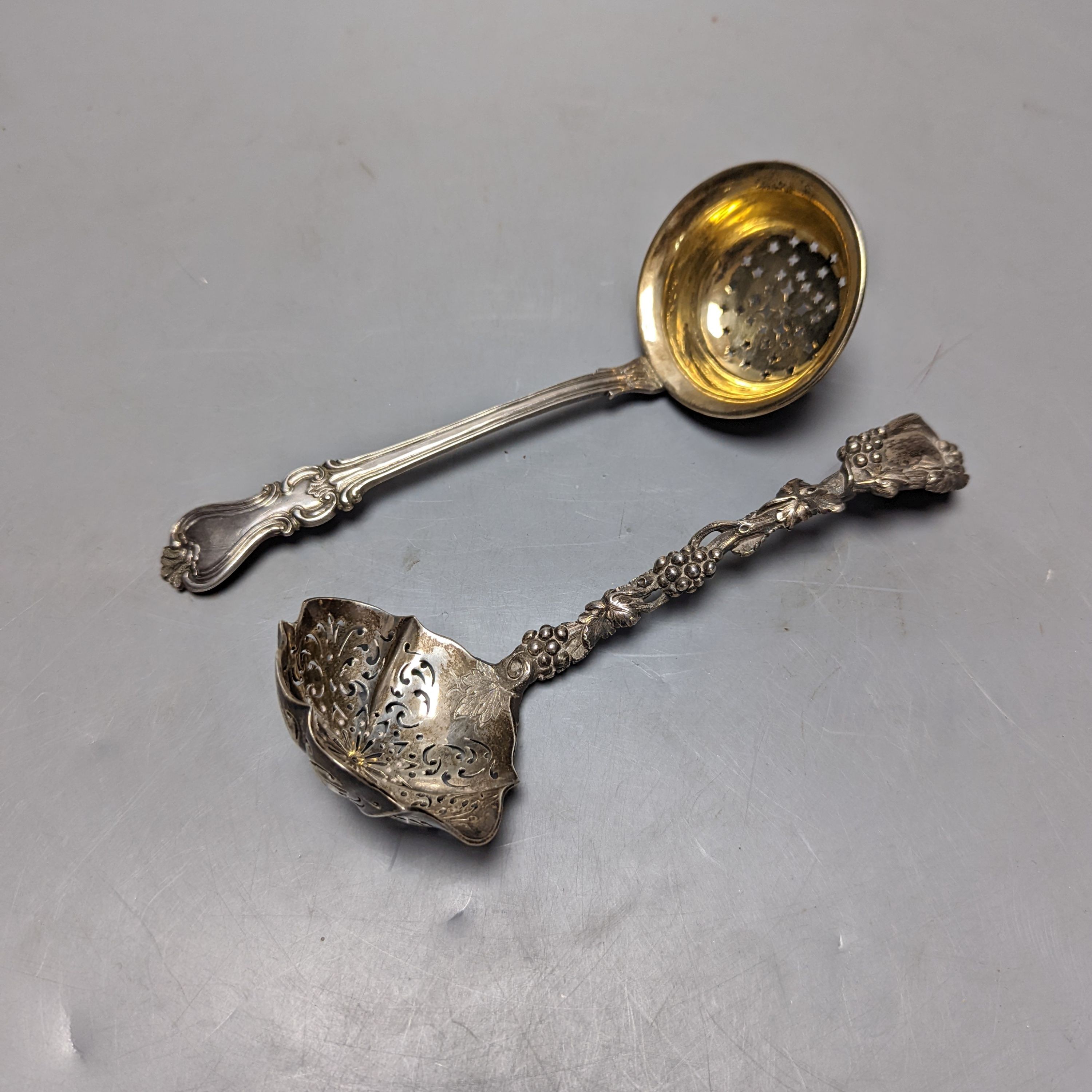 A late 19ty century Russian 84 zolotnik sifter ladle, assay master Ludvig Zug, 187?, 18.7cm, and a Victorian silver sifter spoon with vineous handle, 5oz.